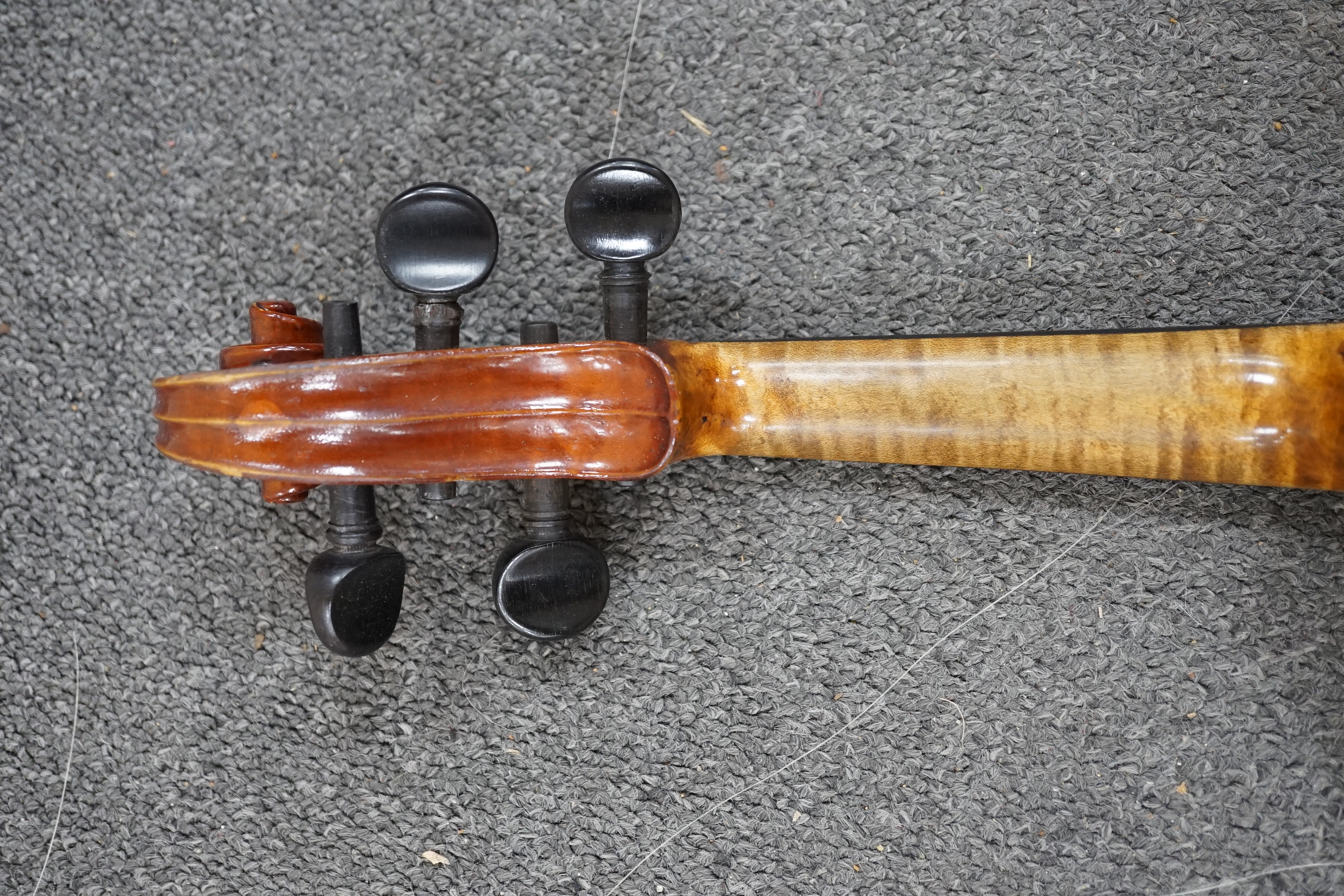 A 19th century violin with silver mounted bow and case, back measures 36cm CITES Submission reference JX7RJU7S